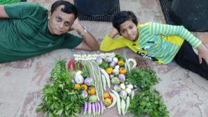 Mythreyan and son proudly presiding over a bountiful harvest_Terrace Garden_Indra Gardens